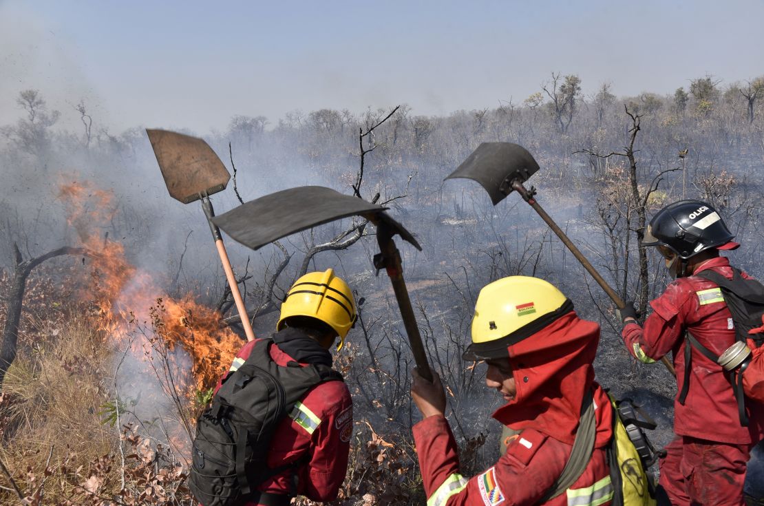 Firefighters try to control a fire near Charagua, Bolivia, on August 29, 2019.