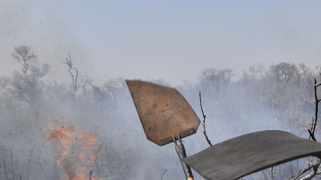 Firefighters try to control a fire near Charagua, Bolivia, on August 29, 2019.