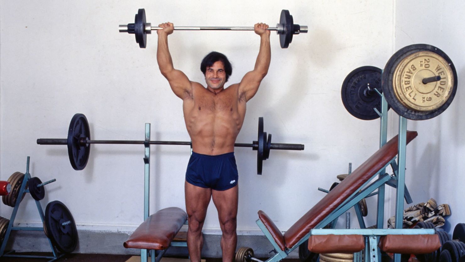 Franco Columbu smiles as he lifts weights in Los Angeles in 1978.