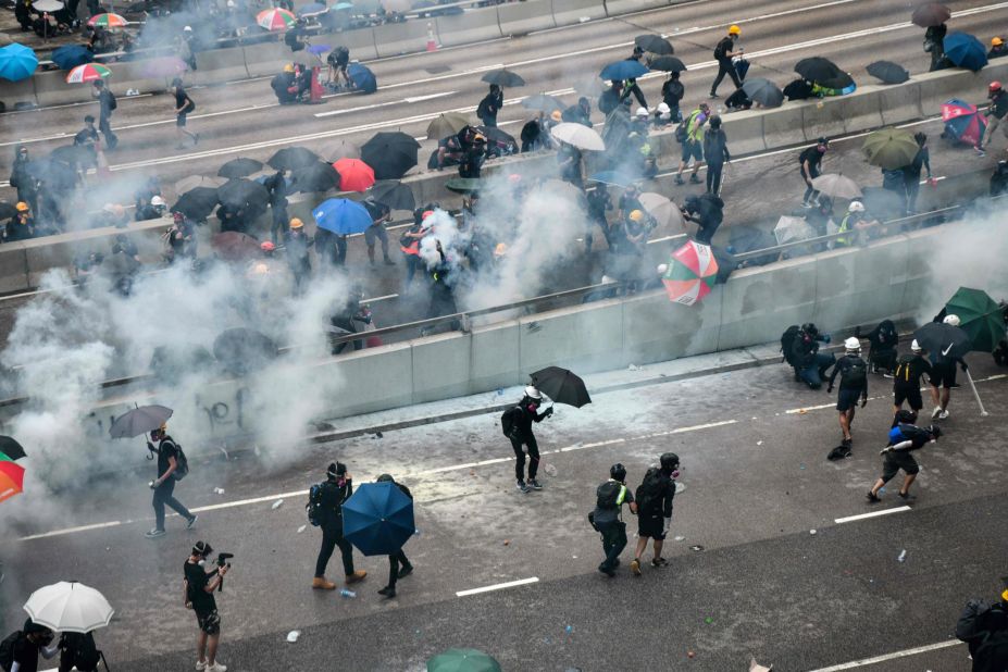 An overhead view shows protesters reacting after police fired tear gas on August 31.