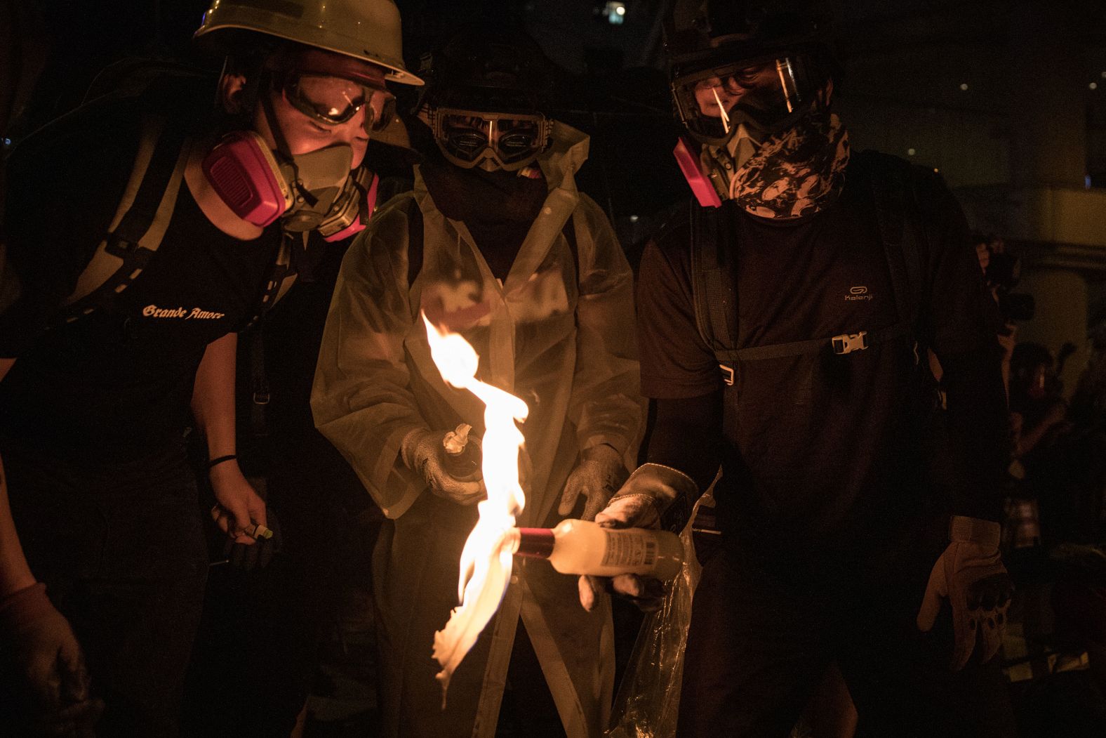 Protesters light a Molotov cocktail on August 31.