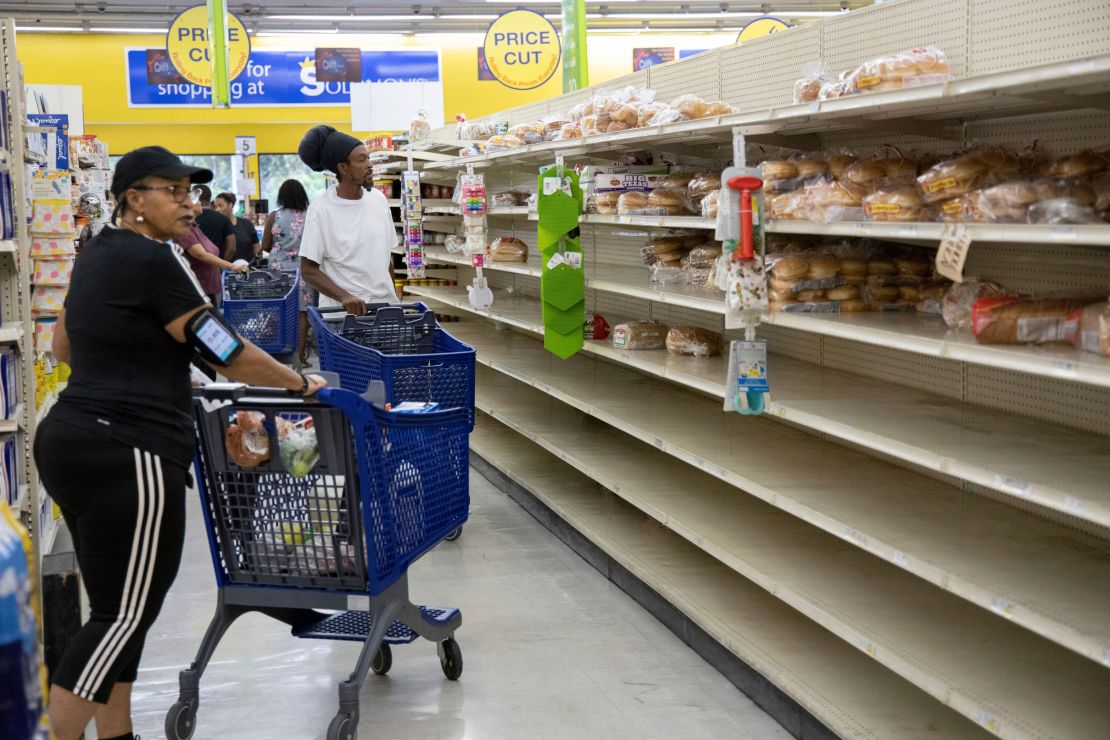 People shop for supplies before the arrival of Hurricane Dorian, in Freeport, Bahamas, on Friday.