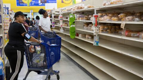 People shop for supplies before the arrival of Hurricane Dorian, in Freeport, Bahamas, on Friday.