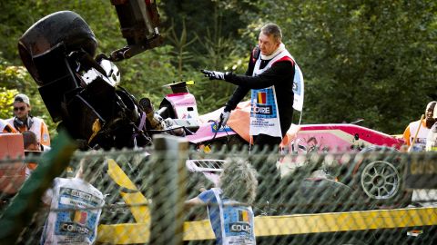 A crane clears the wreckage following Anthoine Hubert's crash.