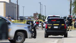 CORRECTS THE NAME OF THE SOURCE TO THE MIDLAND REPORTER-TELEGRAM - Odessa and Midland police and sheriff's deputies surround the area behind Cinergy in Odessa, Texas, Saturday, Aug. 31, 2019, after reports of shootings. Police said there are "multiple gunshot victims" in West Texas after reports of gunfire on Saturday in the area of Midland and Odessa. (Tim Fischer/Midland Reporter-Telegram via AP)