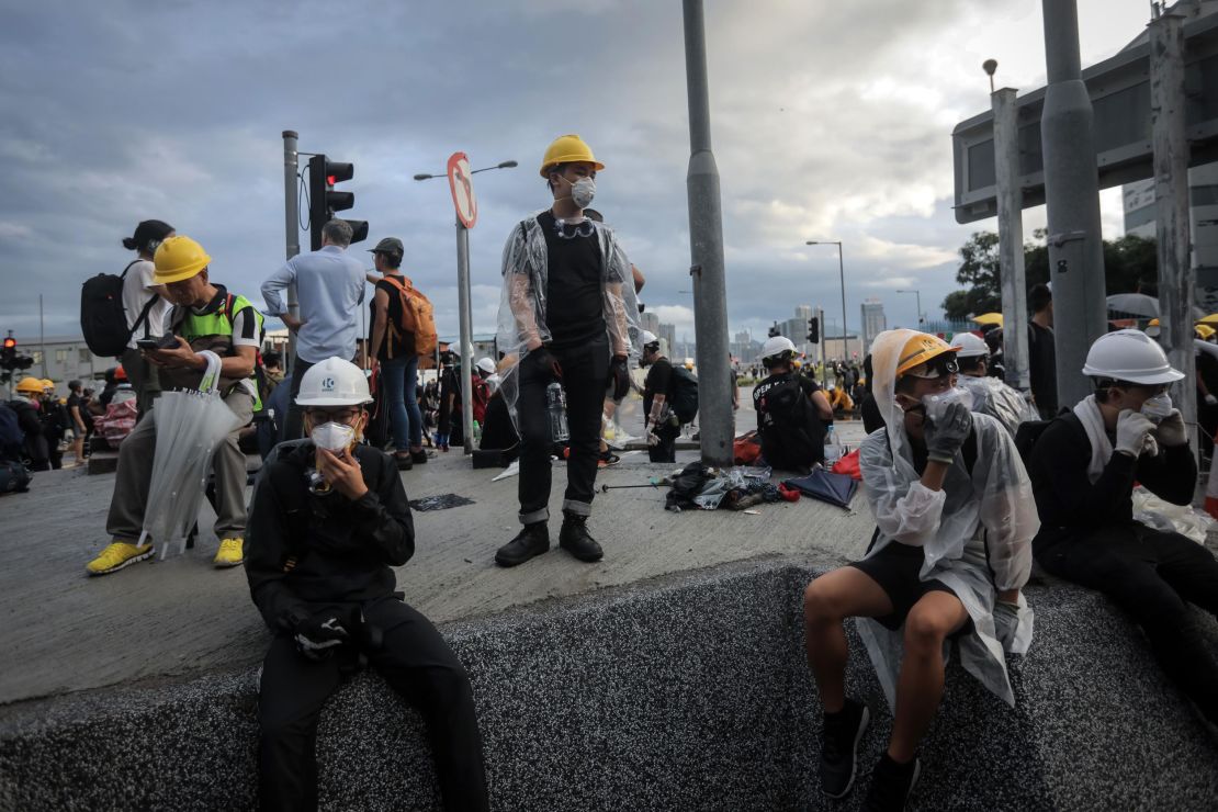 Protesters stand behind barricades outside the government headquarters the morning of July 1.