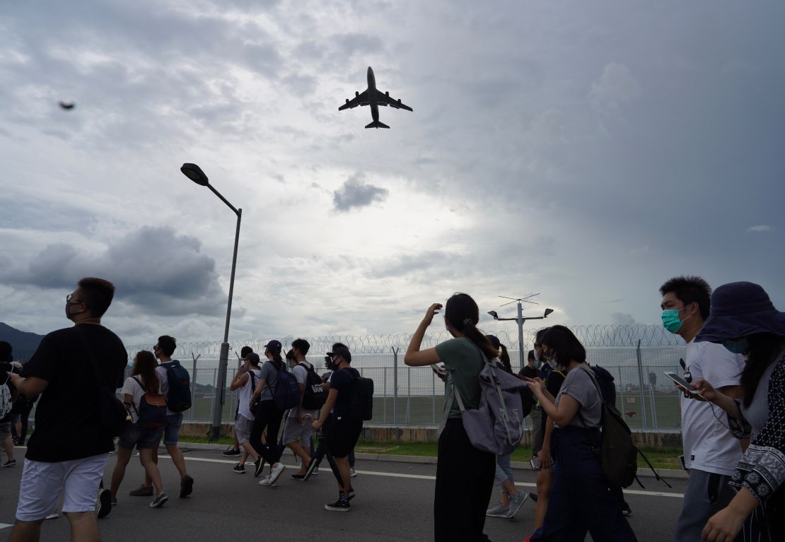 Pro-democracy protestors walk back after gathering outside the airport in, Hong Kong, Sunday, Sept.1, 2019. 
