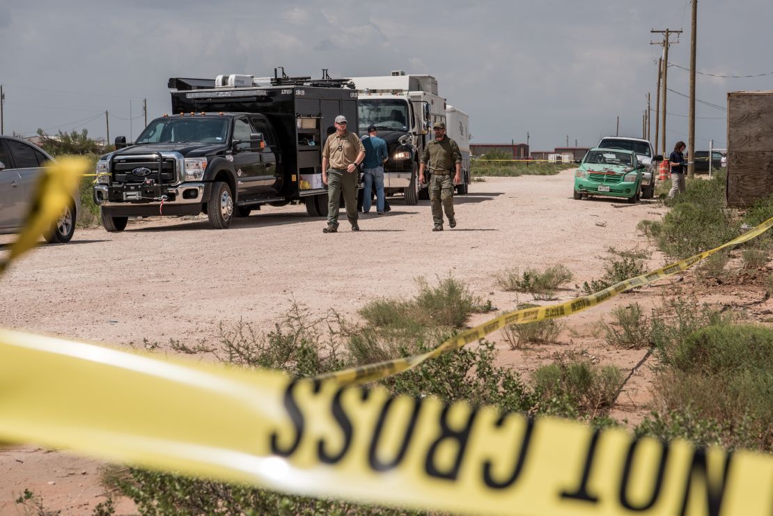 FBI agents search a home believed to be linked to a suspect following a deadly shooting spree on September 1, 2019 in West Odessa, Texas.