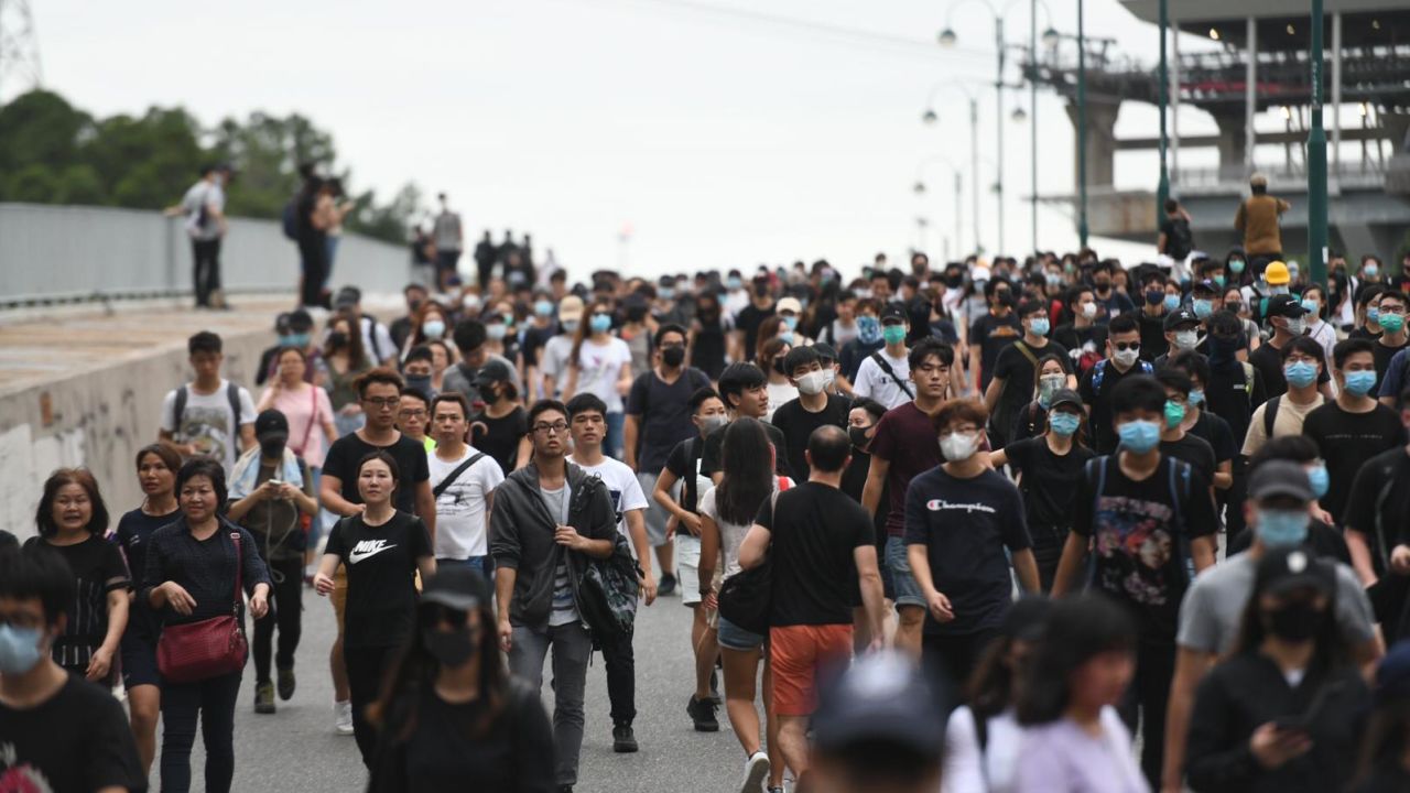 Crowds of protesters head from Hong Kong international airport to nearby Tung Chung.