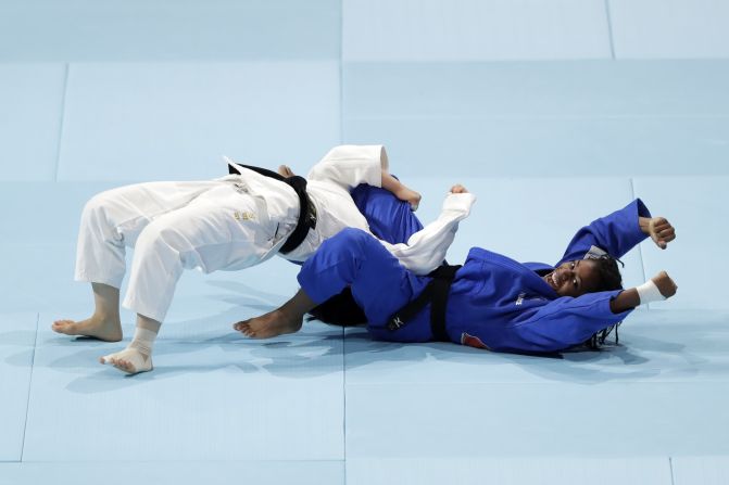 Sarah Leonie Cysique of France, right, celebrates her win over Tsukasa Yoshida of Japan in the Mixed Team final between Japan and France on Day 8 of the World Judo Championships in Tokyo, Japan, on September 1.