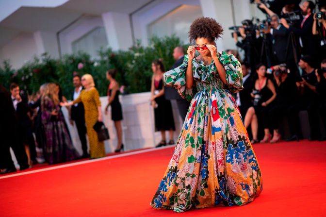 "Joker" star Zazie Beetz arrives at the movie's premiere in a vibrant haute couture design by Valentino. 