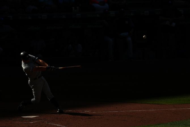 DJ LeMahieu of the New York Yankees hits a solo home run in the ninth inning against the Seattle Mariners during their game at T-Mobile Park in Seattle, Washington, on August 28.