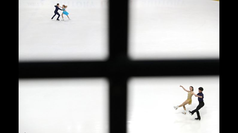 Utana Yoshida and Shingo Nishiyama of Japan, bottom, and Anna Lavrova and Maxwell Gart of the United States warm up before the Junior Ice Dance - Rhythm Dance at the ISU Junior Grand Prix of Figure Skating in Lake Placid, New York, on August 30.