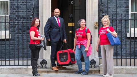 Volunteers from Friends of Animals Wales deliver a 15-week-old puppy adopted by Prime Minister Boris Johnson and his partner Carrie Symonds to Downing Street.