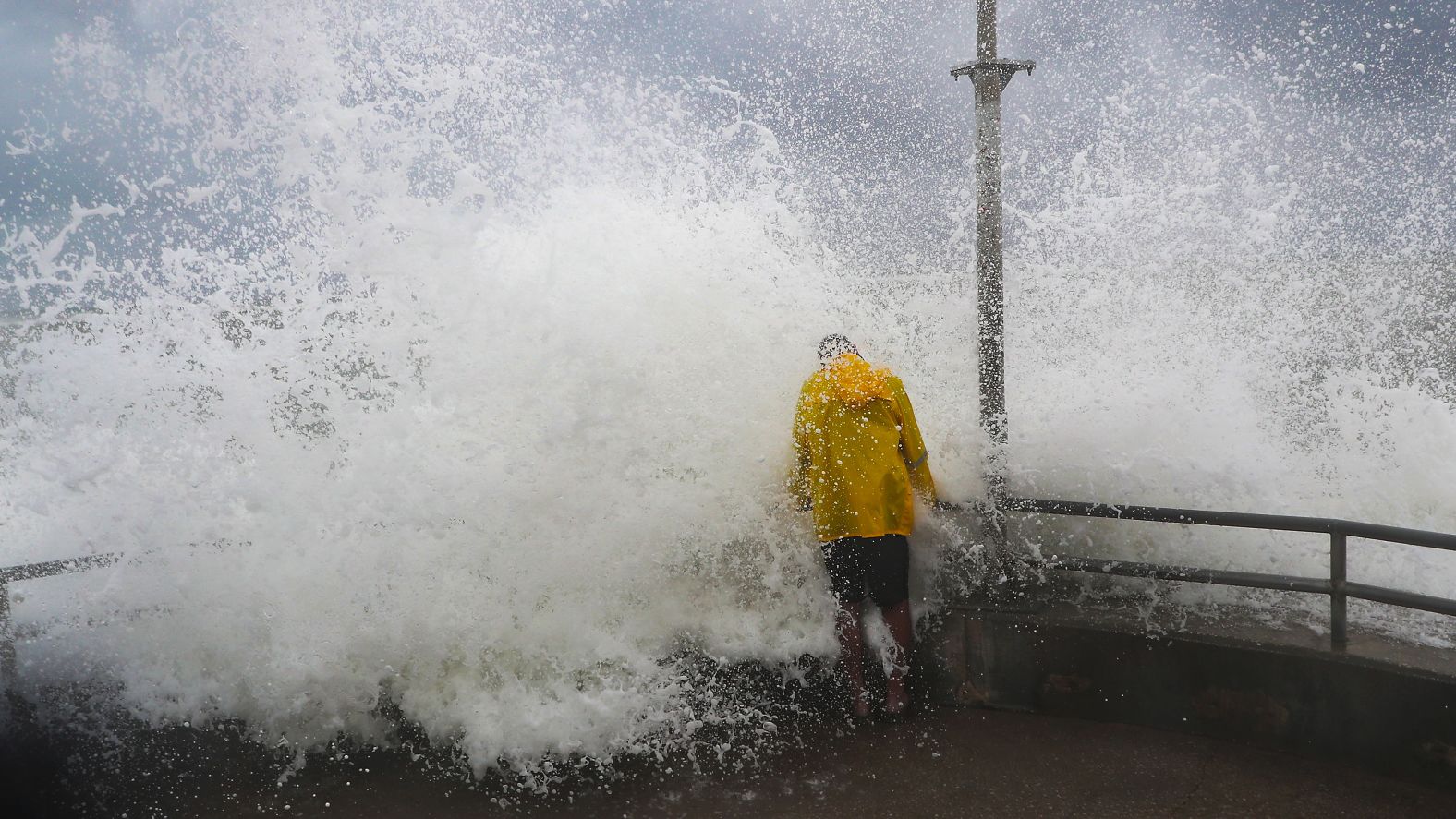 Waves caused by Dorian crash into a man at the Jupiter Beach Park in Florida on September 2.