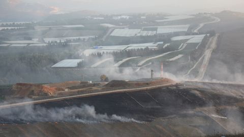 Fields near the border outside Maroun al-Ras were on fire after Israel struck Lebanese soil on Sunday.