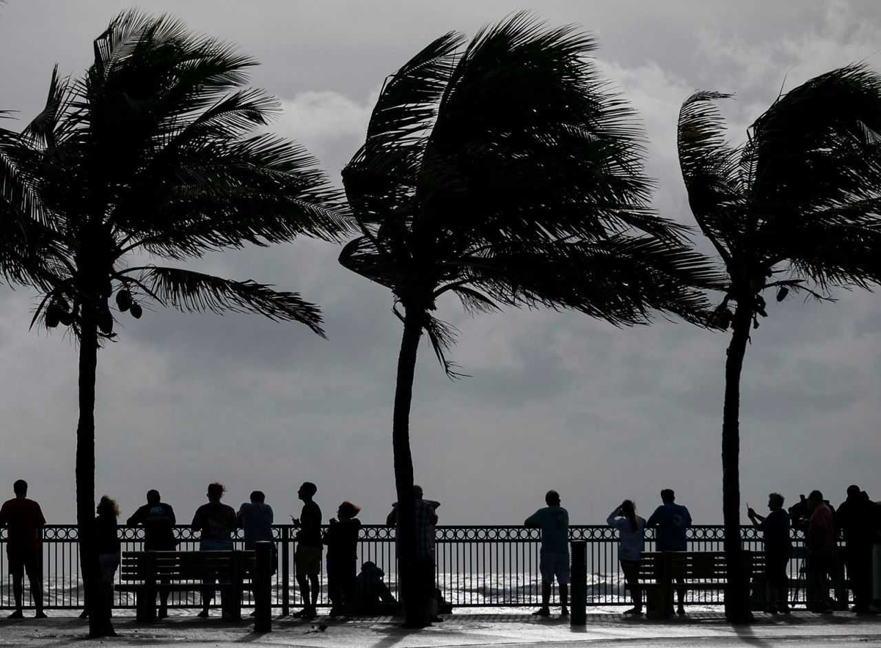 People watch the waves crash onto Vero Beach, Florida, on September 2.
