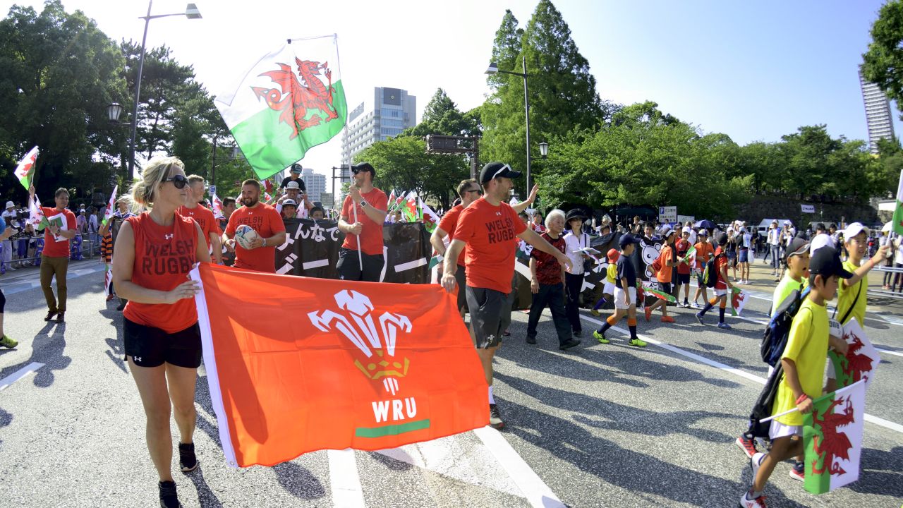Welsh flags are carried through Kitakyushu.