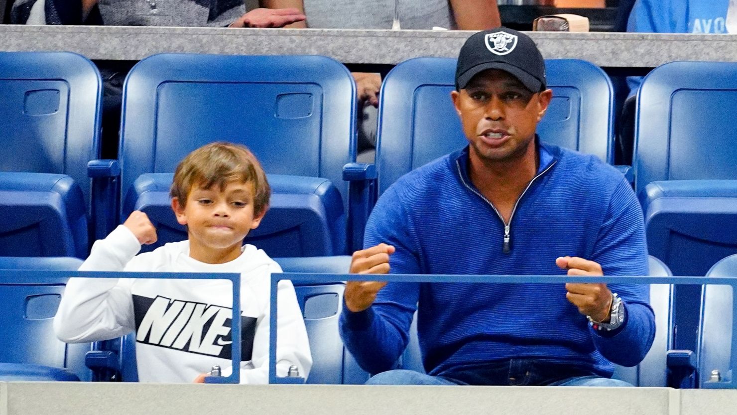 Tiger Woods and his son Charlie Axel Woods cheer on Rafael Nadal at the US Open in New York.