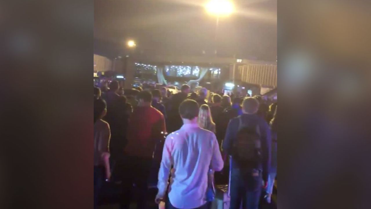 Nearly 200 passengers evacuated at the urging of a Newark airport employee.