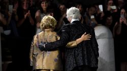 German designer Karl Lagerfeld and Silvia Fendi acknowledge the audience at the end of the Fendi fashion show at the Trevi Fountain in Rome, in 2016.