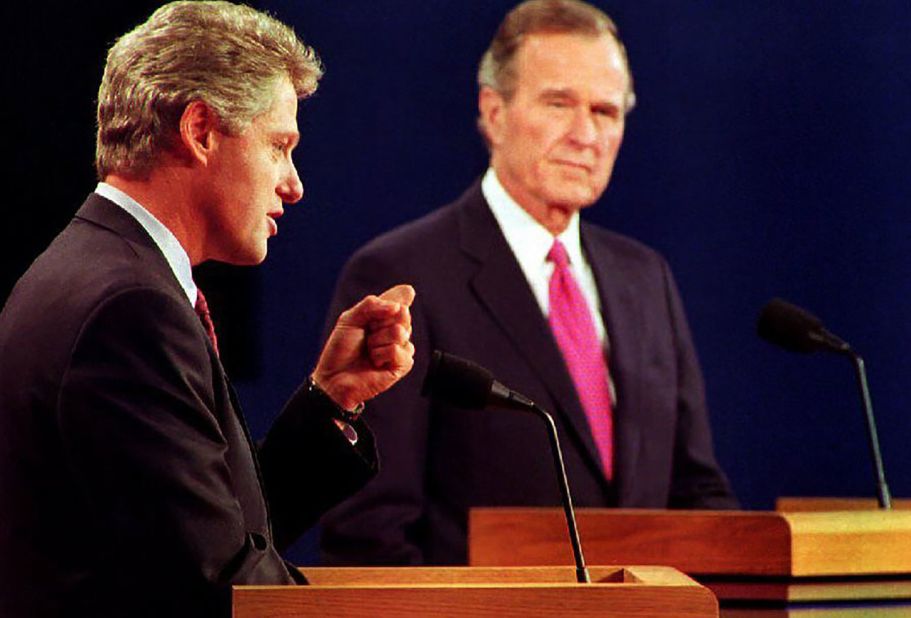 Clinton debates President George H.W. Bush and independent candidate H. Ross Perot, not pictured, in October 1992. It was their third and final debate.