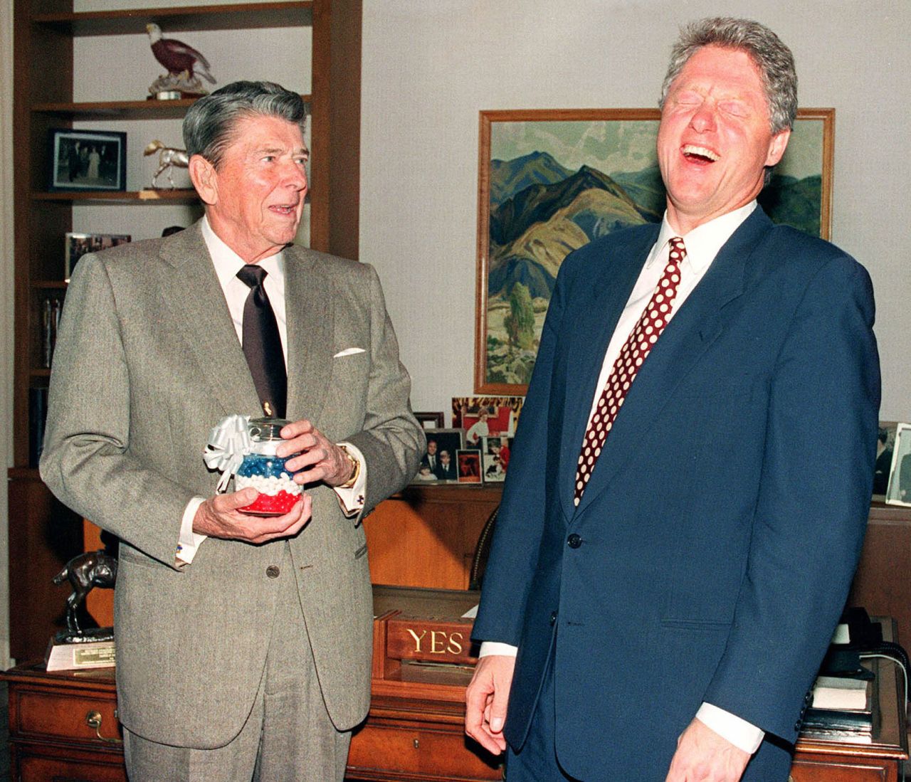 Former President Ronald Reagan presents Clinton with a jar of red, white and blue jelly beans in Los Angeles in November 1992. Reagan said they kept him from smoking cigarettes.