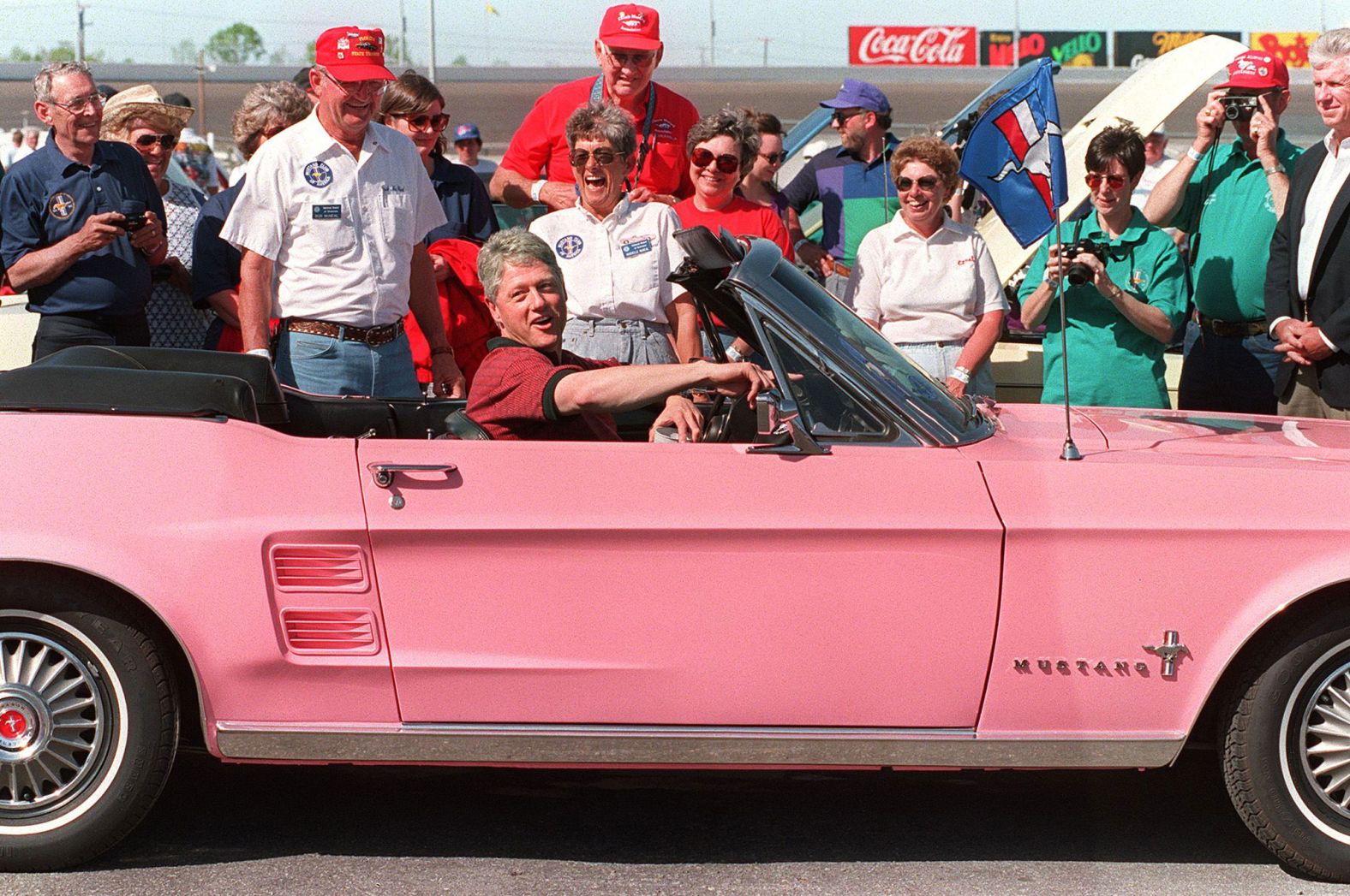 Clinton sits in a 1967 Ford Mustang while visiting the Charlotte Motor Speedway in North Carolina in April 1994.