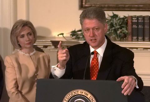 Clinton speaks about the Monica Lewinsky scandal at the White House in January 1998, as first lady Hillary Clinton looks on. "I did not have sexual relations with that woman," he said.