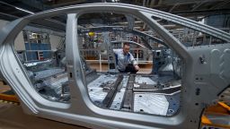 14 May 2019, Saxony, Zwickau: Heiko Rösch, Head of Body Construction, explains a body study of the new Volkswagen ID.3 at the Volkswagen Sachsen plant in Zwickau. Volkswagen is currently completely converting production at its plant in Saxony to the manufacture of electric vehicles. The first vehicles are scheduled to roll off the assembly line at the end of the year. Photo: Hendrik Schmidt/dpa-Zentralbild/ZB (Photo by Hendrik Schmidt/picture alliance via Getty Images)