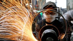 A worker welds bicycle steel rims at a workshop in Tianmushan town on September 2, 2019 in Hangzhou, Zhejiang Province of China.