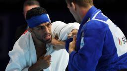 In this picture taken on August 28, 2019, Iran's Saeid Mollaei (in white) fights against Belgium's Matthias Casse during the semi-final of the men's under 81kg category during the 2019 Judo World Championships at the Nippon Budokan, a venue for the upcoming Tokyo 2020 Olympic Games, in Tokyo. - Iranian judo star Saeid Mollaei, who claimed he was ordered to deliberately lose a world championship fight, could compete under a refugee flag at the 2020 Tokyo Olympics, officials said on September 1. (Photo by Charly TRIBALLEAU / AFP)        (Photo credit should read CHARLY TRIBALLEAU/AFP/Getty Images)