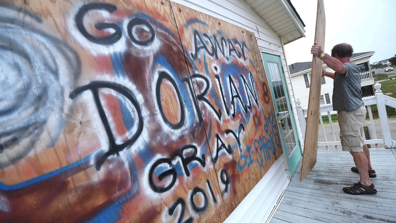 Bob Quarles boards up his beach house in Oak Island, North Carolina, on September 4.