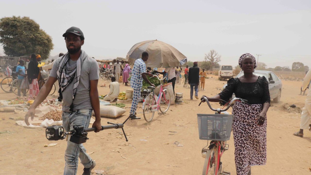 Yana Galang (R) and Joel Benson (L) at the market in Chibok