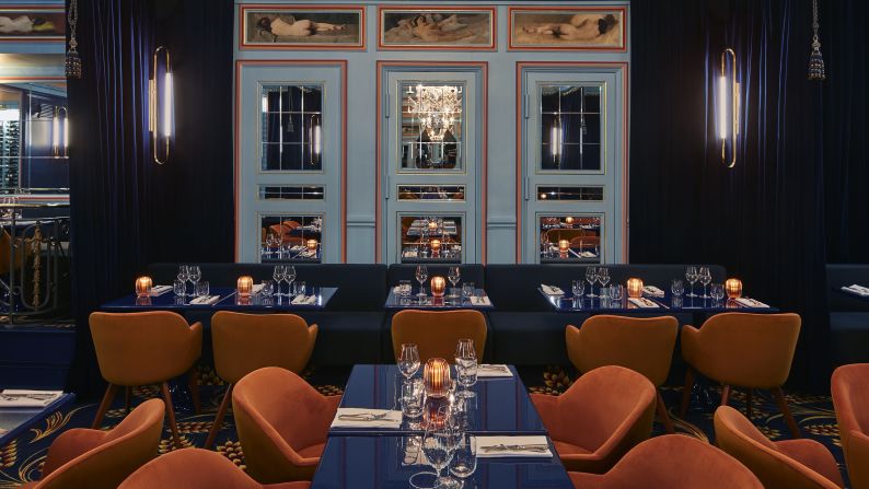 <strong>Froufrou: </strong>The décor at this spot is theatrica,l with heavy, velvet midnight blue curtains that set off brass details and mirrored walls, in a nod to the Belle Époque when the theater was born.