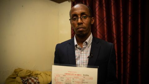Omar Sharif holds his Kenyan birth certificate. He's never set foot in Somalia but it took him only a few minutes to register as a Somali refugee.