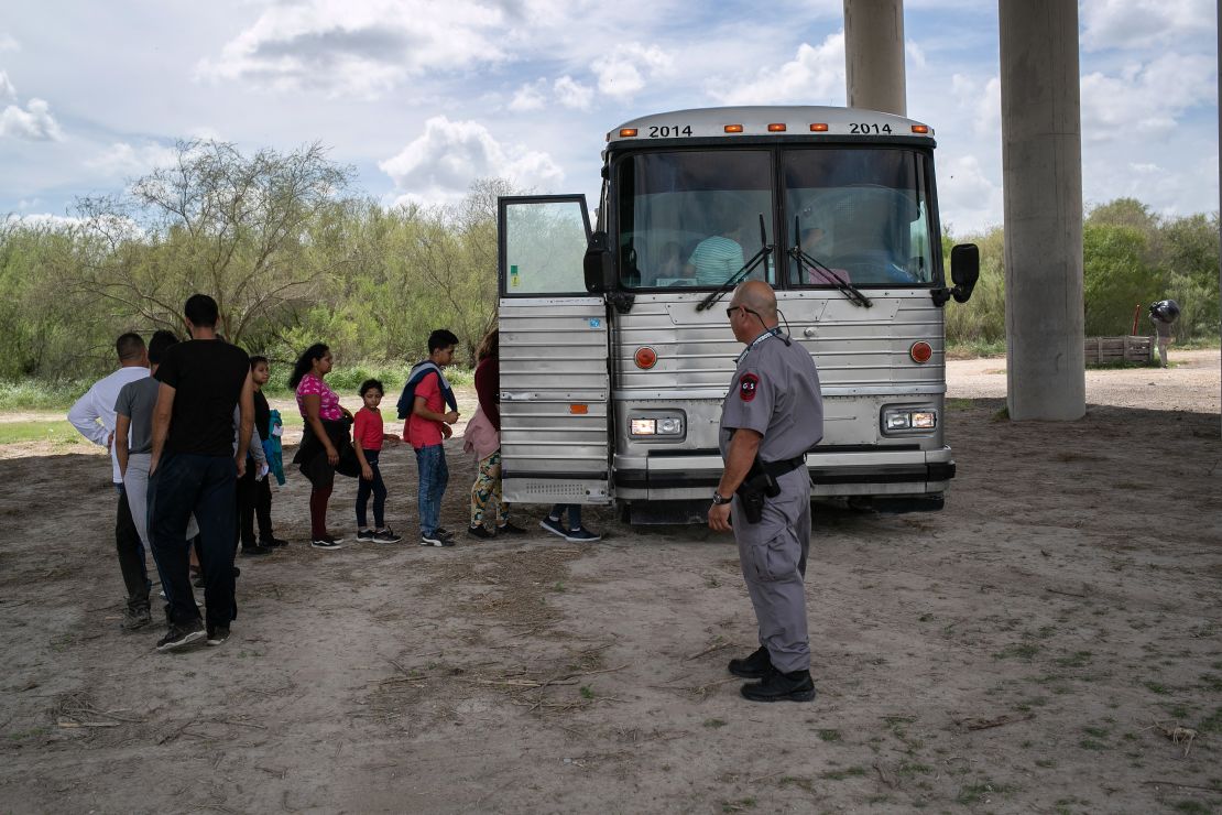 Before the pandemic, children and families who were taken into custody at the border — like this group awaiting processing in 2019 -- had a chance to seek asylum in the US. Now, most are expelled without court hearings.