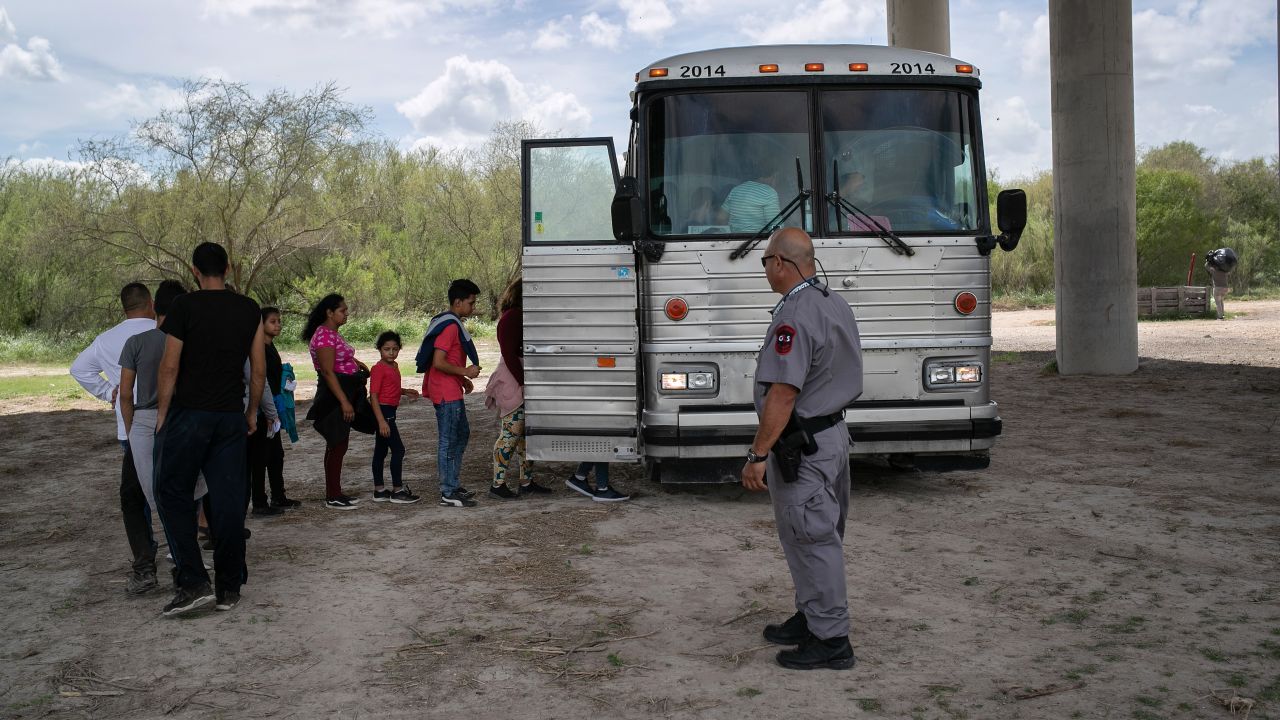 Immigrants are transported to a processing center after they were taken into custody by US Border Patrol agents on July 2, 2019, in McAllen, Texas.