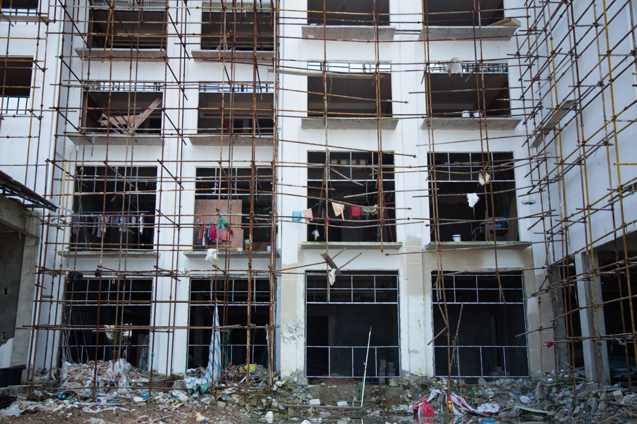 On construction sites, workers live in the half-constructed buildings, a major safety hazard.