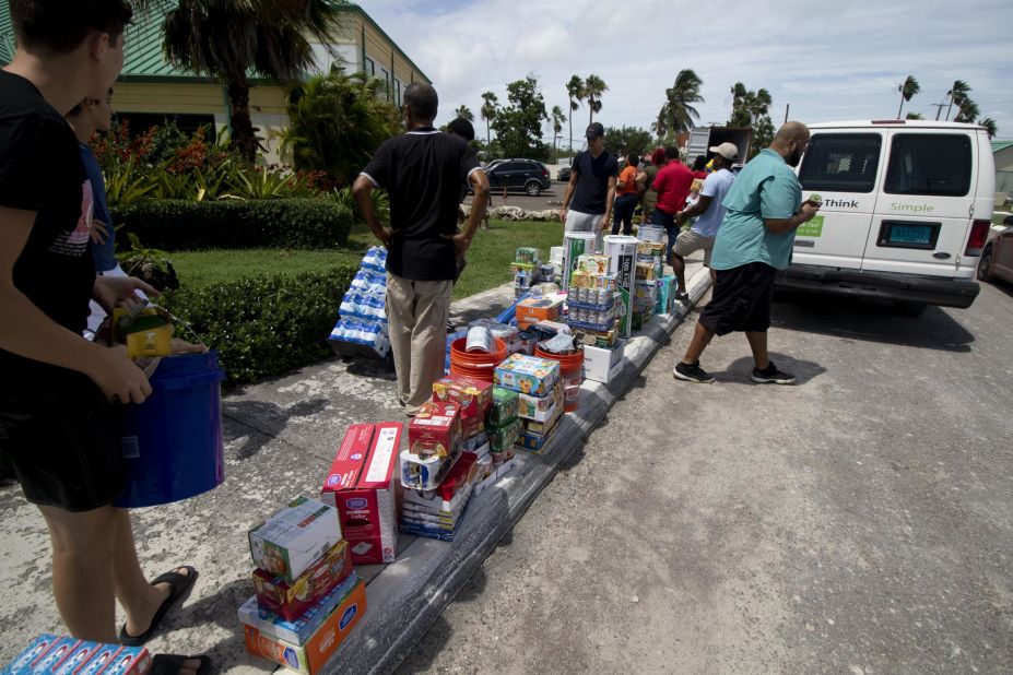 Volunteers receive relief supplies at the New Providence Community Center in Nassau.