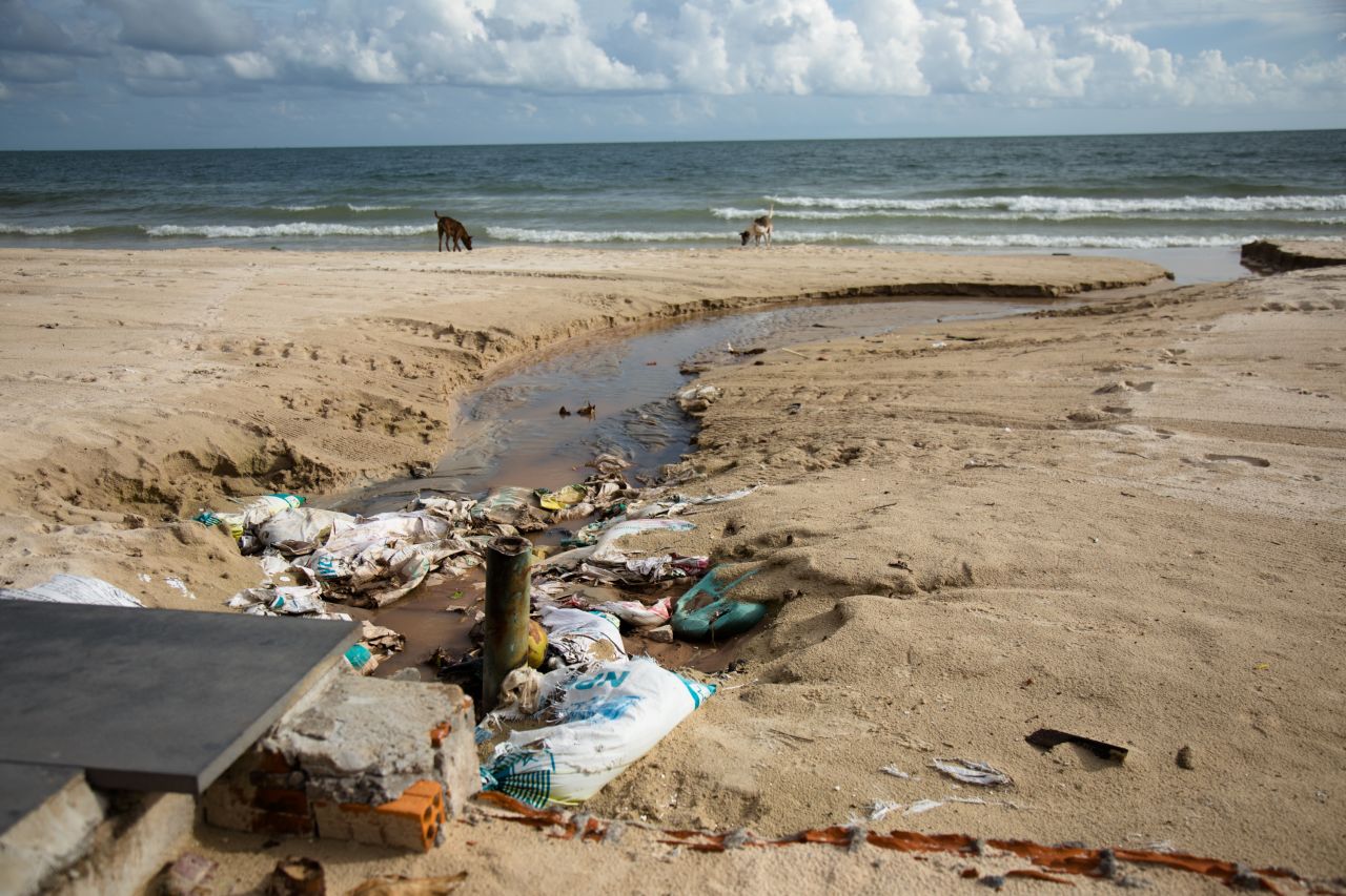 Raw sewage flows straight into the sea. The beach is also littered with plastic.