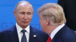Russian President Vladimir Putin (L) looks at U.S. President Donald Trump during the welcoming ceremony prior to the G20 Summit's Plenary Meeting on November 30, 2018 in Buenos Aires, Argentina. U.S. President Donald Trump cancelled his meeting with Vladimir Putin at the G20 Summit in Argentina planned for Saturday.