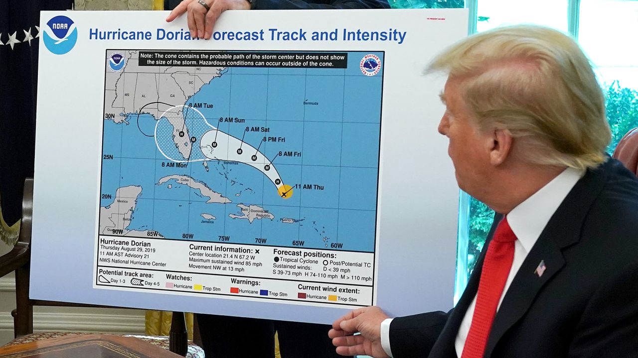 WASHINGTON, DC - SEPTEMBER 04: U.S. President Donald Trump (R) references a map held by acting Homeland Security Secretary Kevin McAleenan while talking to reporters following a briefing from officials about Hurricane Dorian in the Oval Office at the White House September 04, 2019 in Washington, DC. The map was a forecast from August 29 and appears to have been altered by a black marker to extend the hurricane's range to include Alabama. (Photo by Chip Somodevilla/Getty Images)