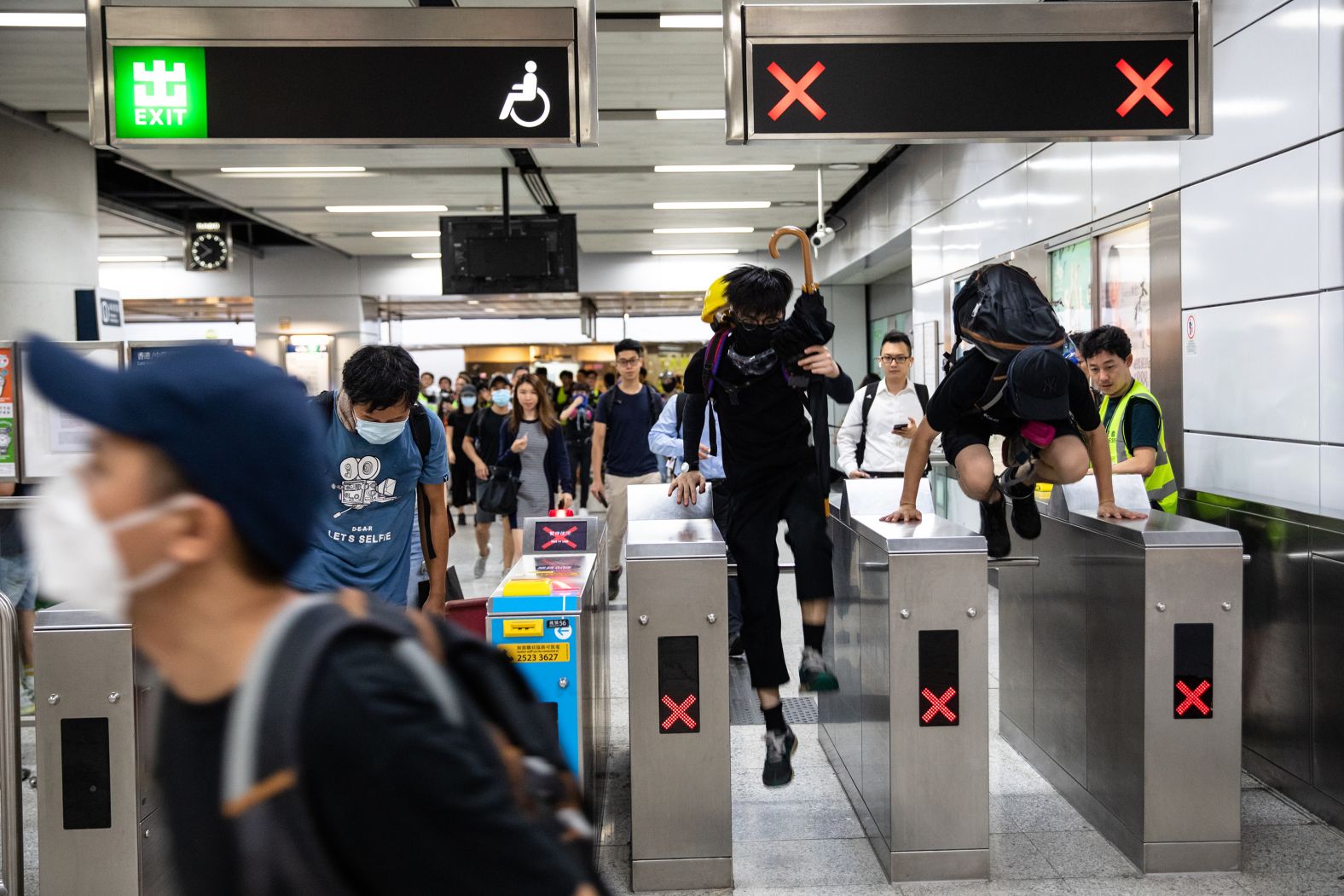 Demonstrators travel through a railway station during a rally on Tuesday, September 3.