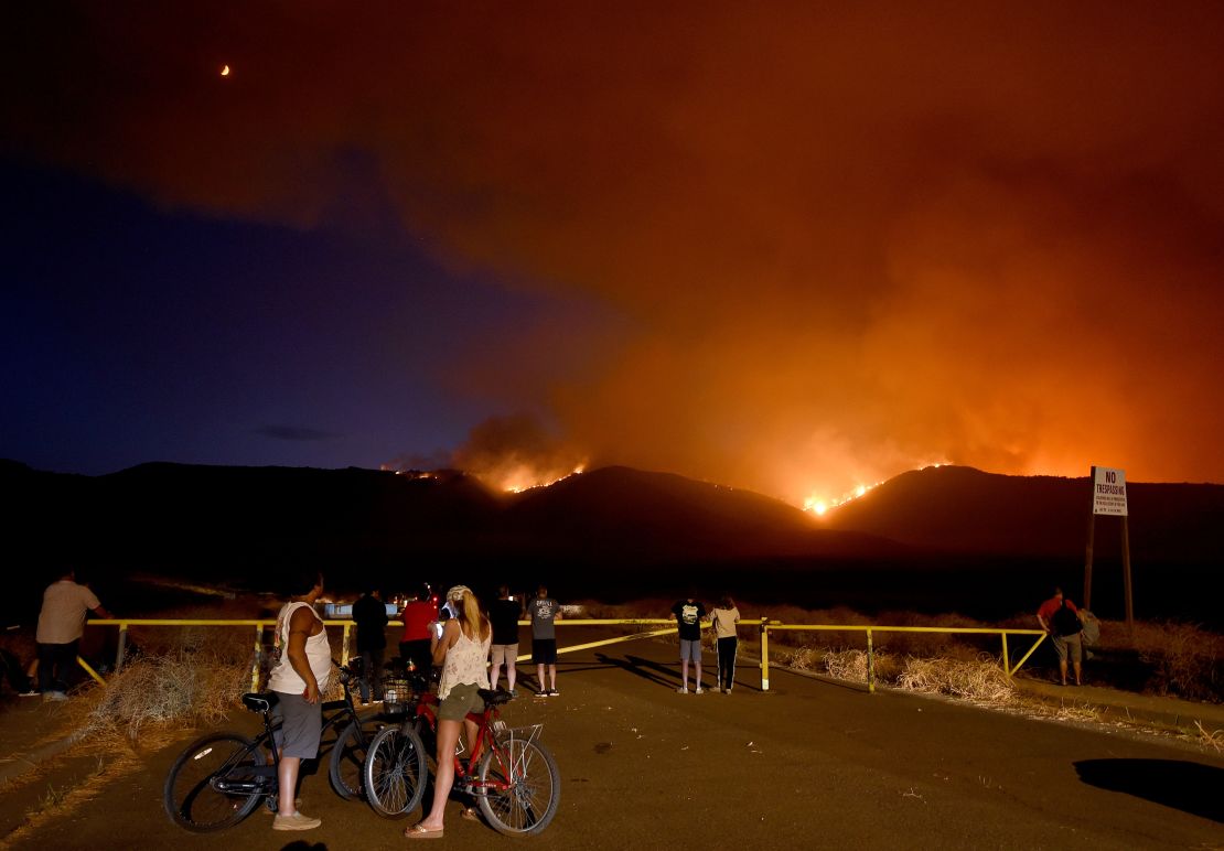Residents watch as the Tenaja Fire burns in Murrieta, California.