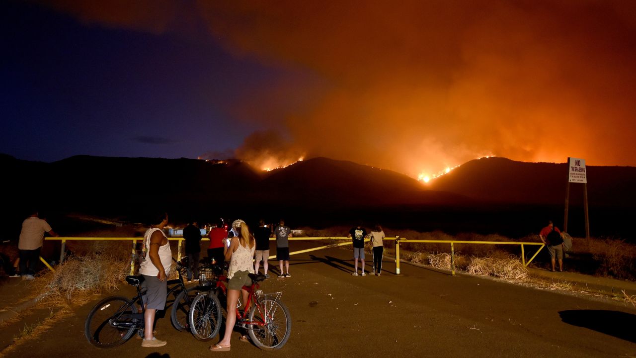 Residents watch as the Tenaja Fire burns in Murrieta, California. 
