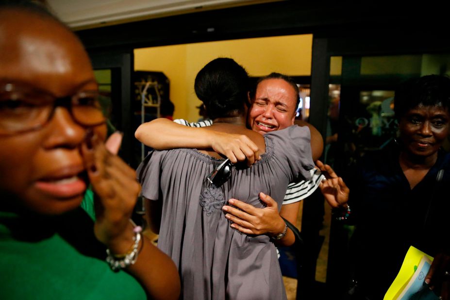 Roshane Eyma cries as she is greeted by members of her church on September 4. She had been rescued and flown to Nassau, Bahamas.