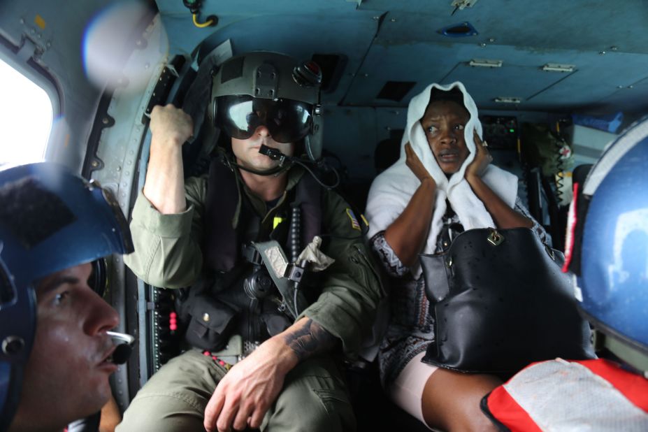 An evacuee rides in a Coast Guard helicopter after being rescued from Treasure Cay, Bahamas, on Wednesday, September 4.