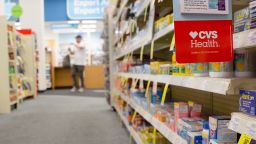Signage is displayed in an aisle of a CVS Health Corp. store in downtown Los Angeles. 