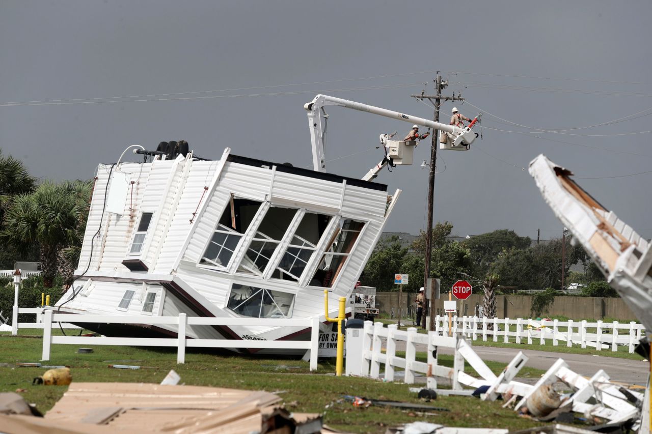 Workers try to restore power after a tornado hit Emerald Isle, North Carolina, on September 5. Several tornadoes were reported in the Carolinas.
